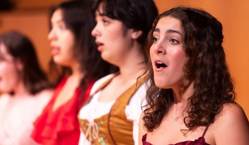 Students sing during an LMU performance